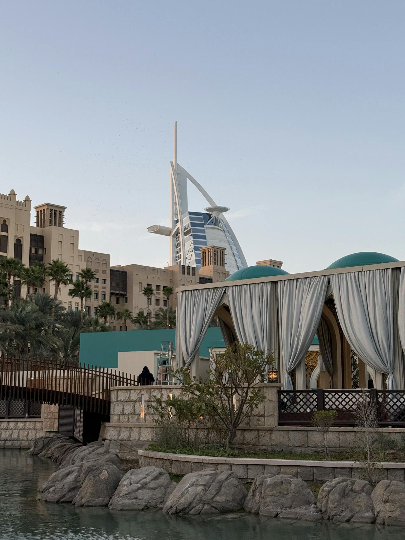 Scenic view of Burj Al Arab with traditional market stalls in the foreground, Dubai.