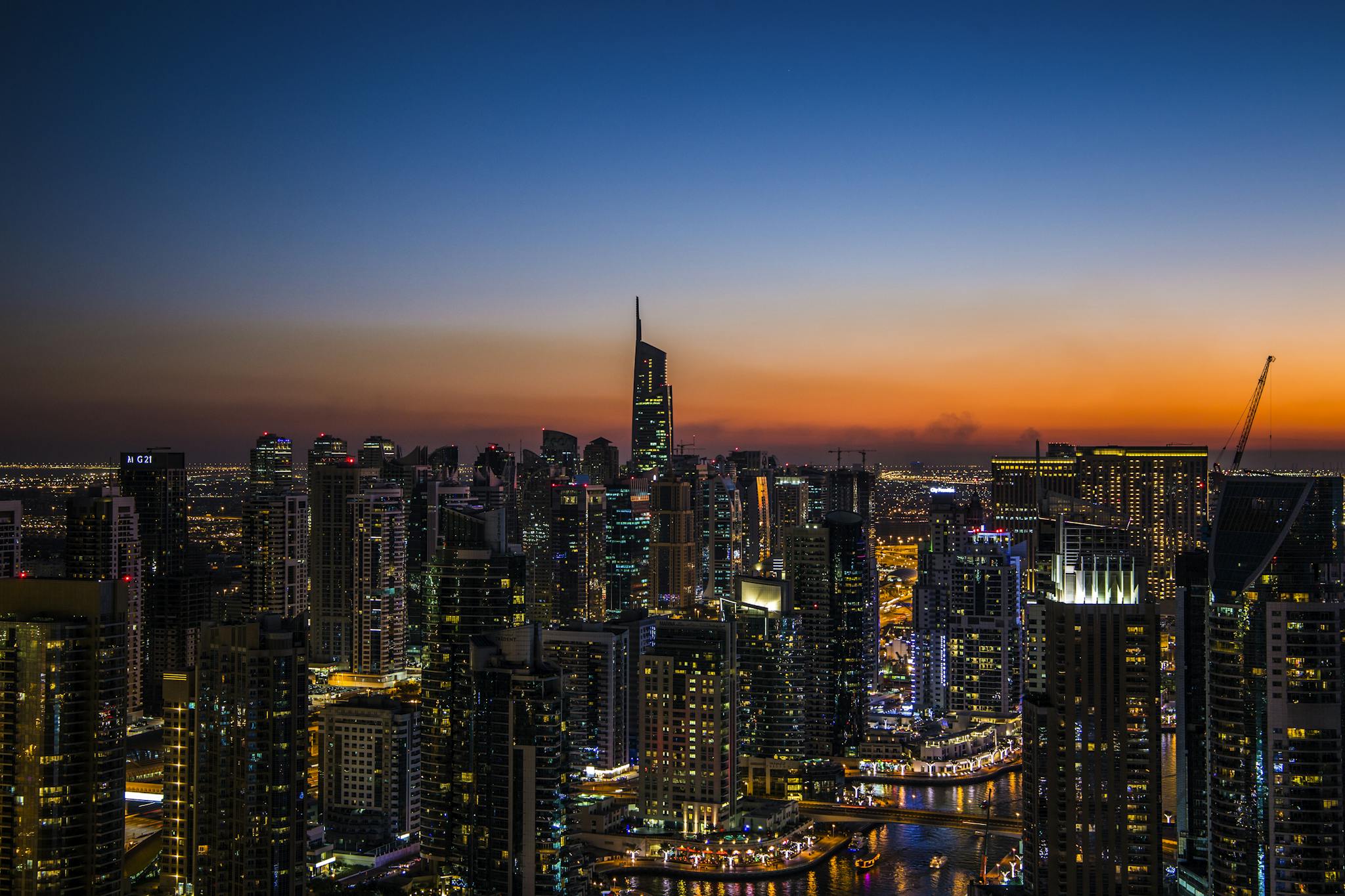 Stunning view of Dubai skyline at twilight showcasing vibrant city lights and modern architecture.